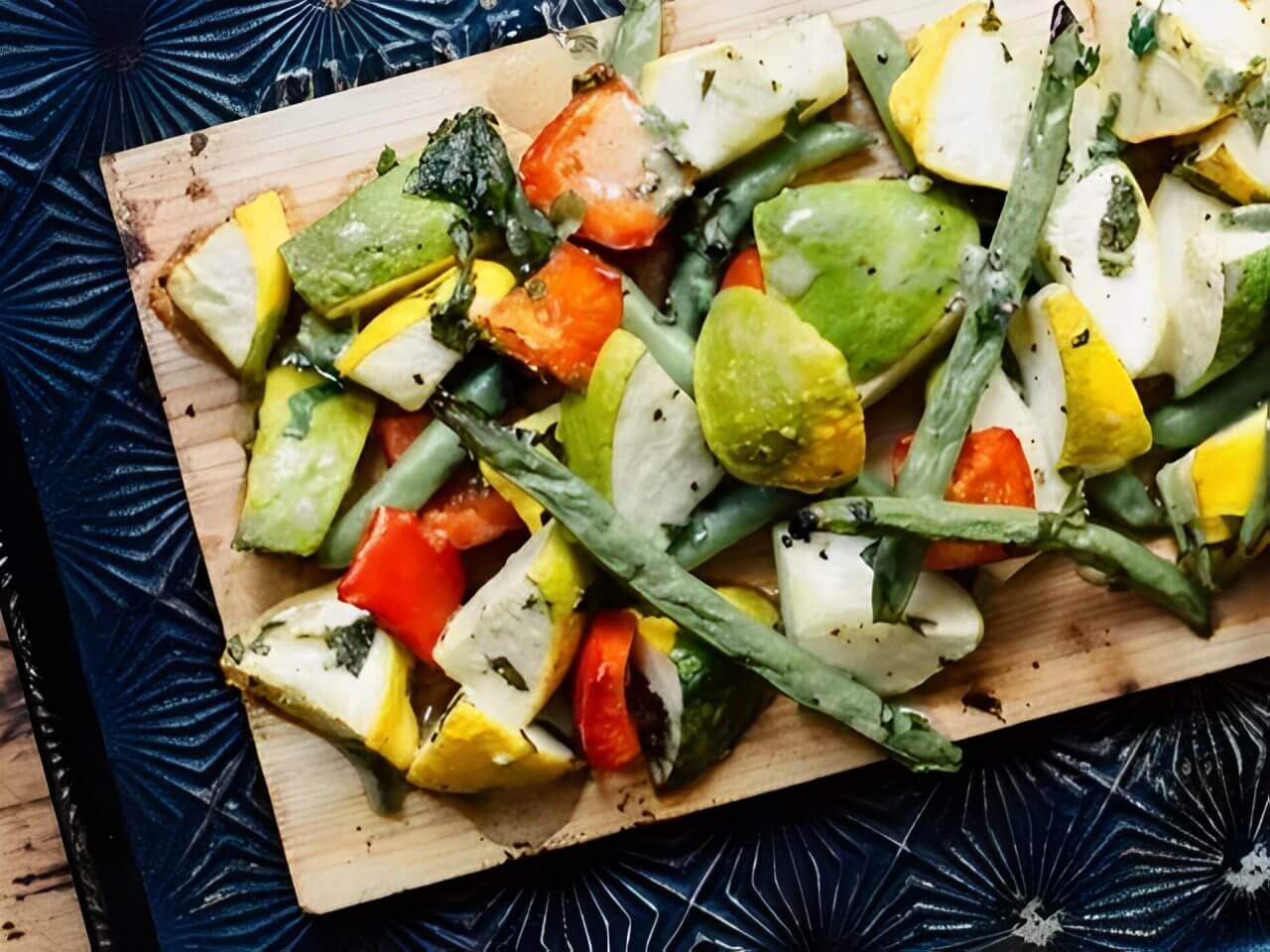 Chopped vegetables on a wooden cutting board.