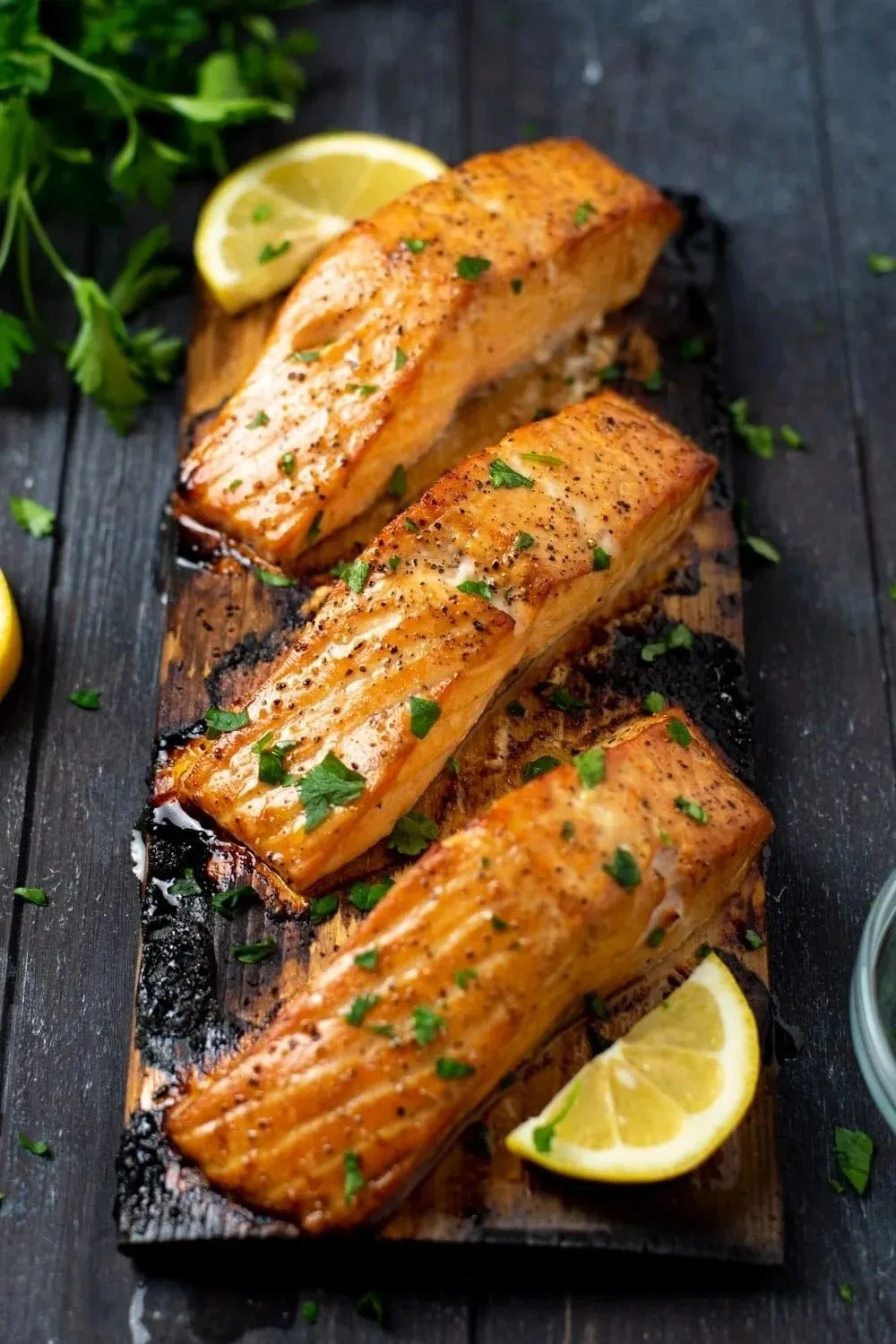 Grilled salmon fillets with lemon and herbs.