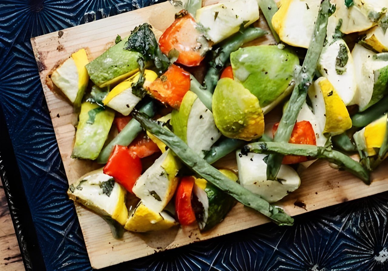 Chopped vegetables on a wooden cutting board.